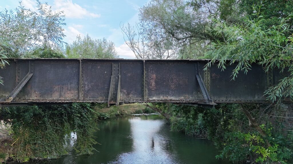 Close view of Aston Cantlow railway bridge crossing the River Alne, showing its riveted iron girder