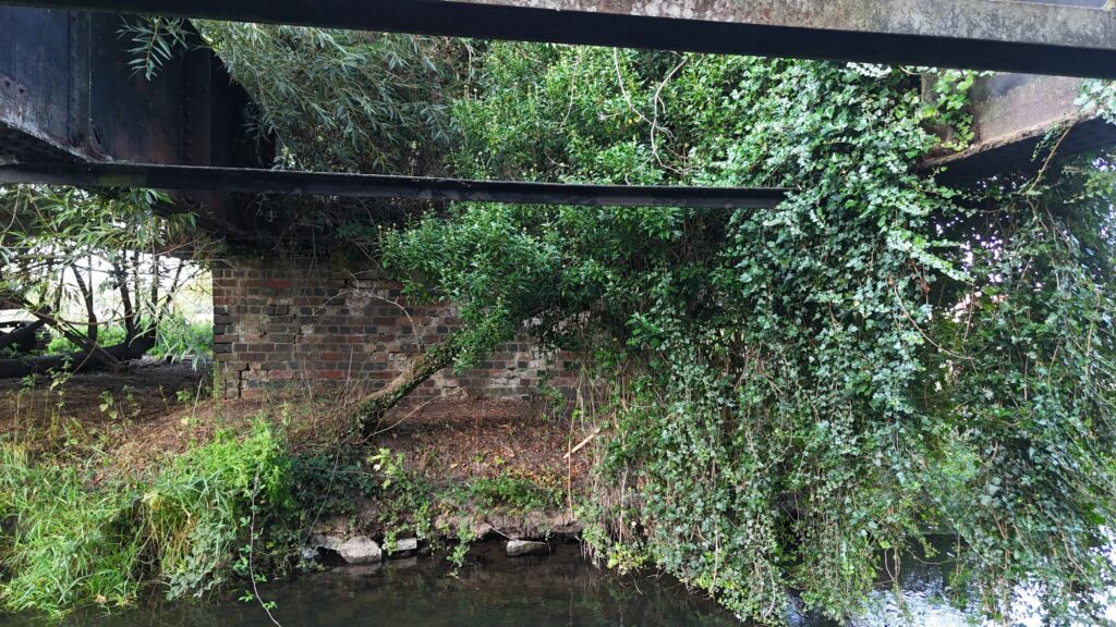 Brick abutment beneath Aston Cantlow railway bridge over the River Alne, looking towards Bearley